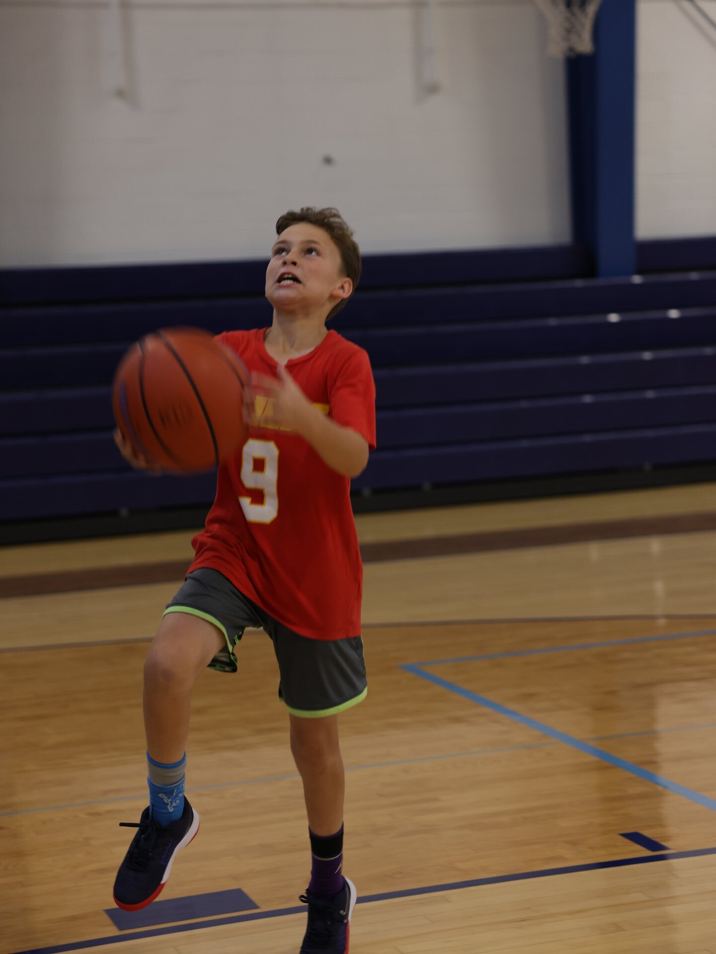 Coach mentoring youth basketball players